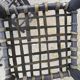 5 blackened wooden stools with woven leather seats by Nina Kaufmann