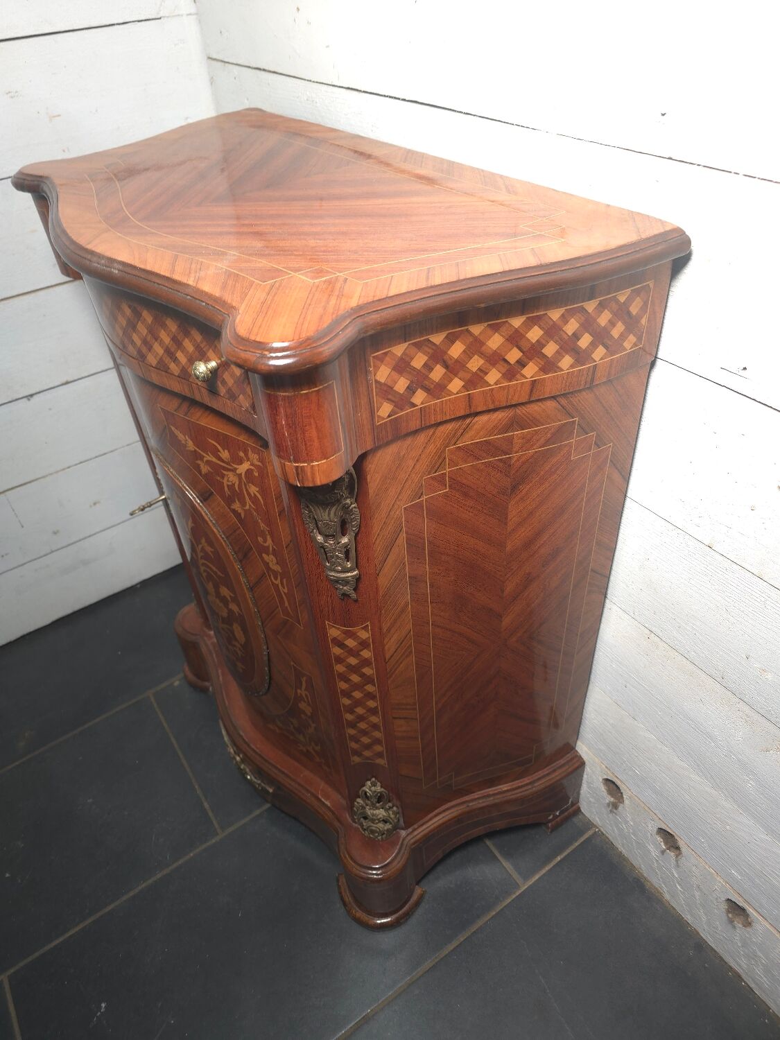 Small support table in Louis XV style with marquetry and bronze.