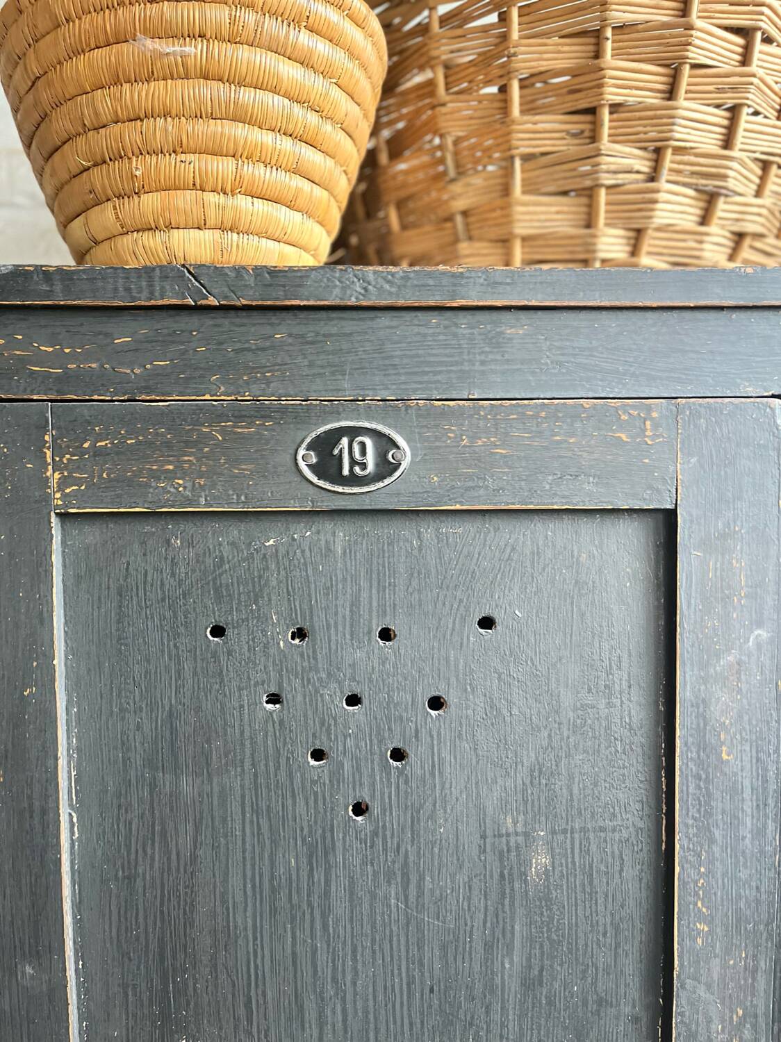 Old wooden locker with black patina