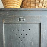 Old wooden locker with black patina
