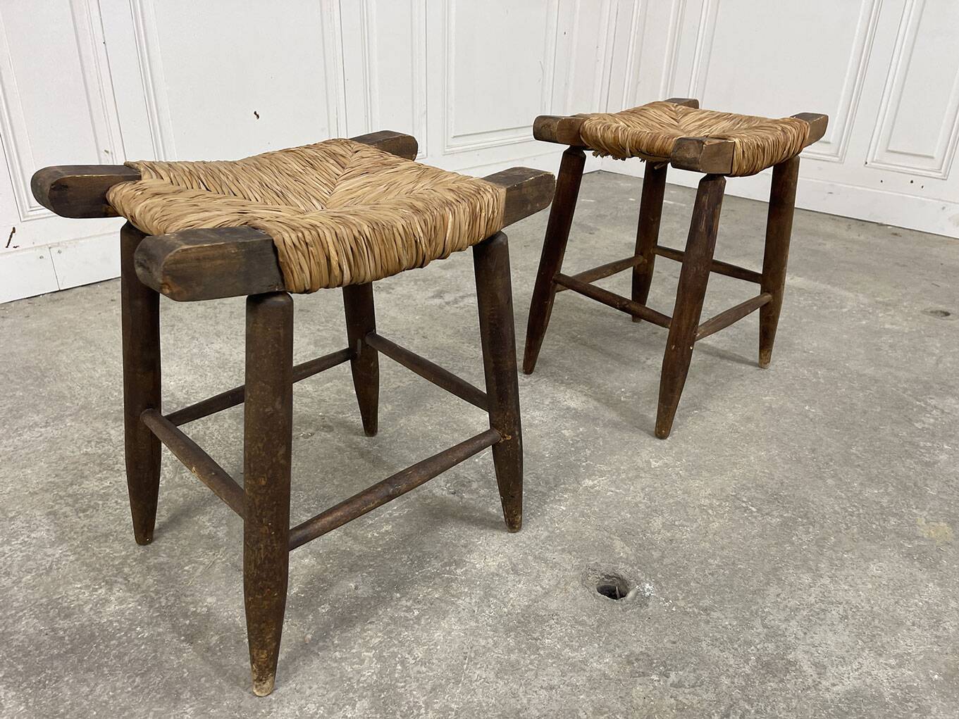 A pair of 1950s straw stools.