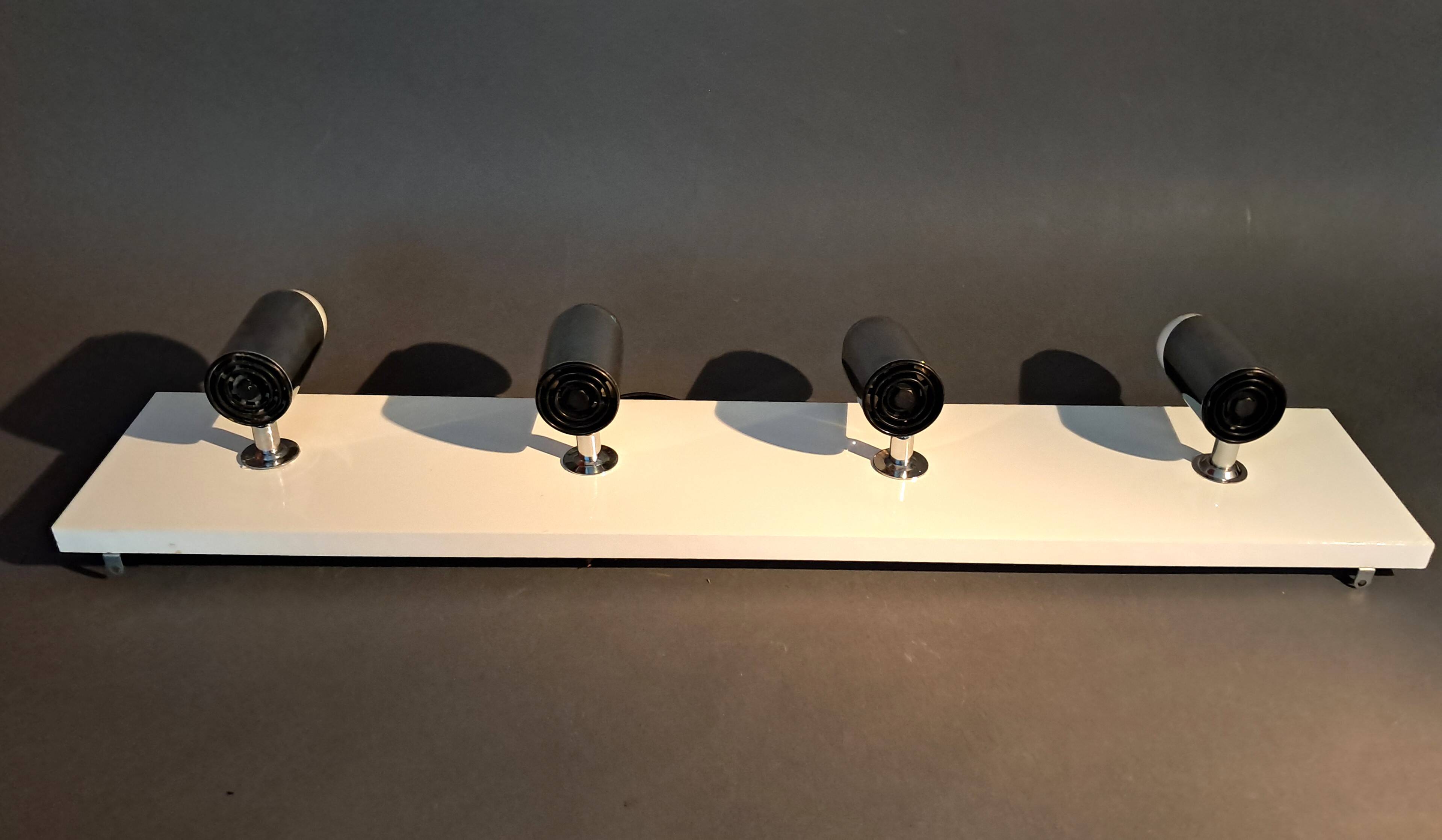 Targetti Sankey spotlights on white lacquered wooden ramp