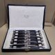 12 Silver dessert knives, ebony, steel, late 19th century