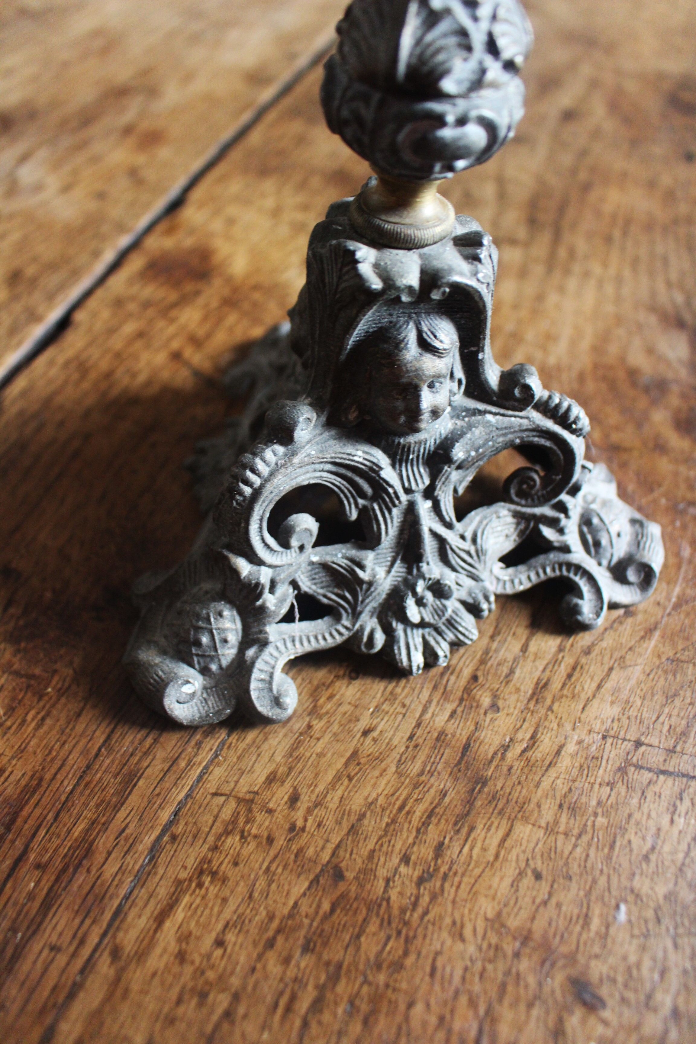 Grey cherub church torch candlestick