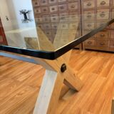 Rectangular dining table with glass top from Roche Bobois.