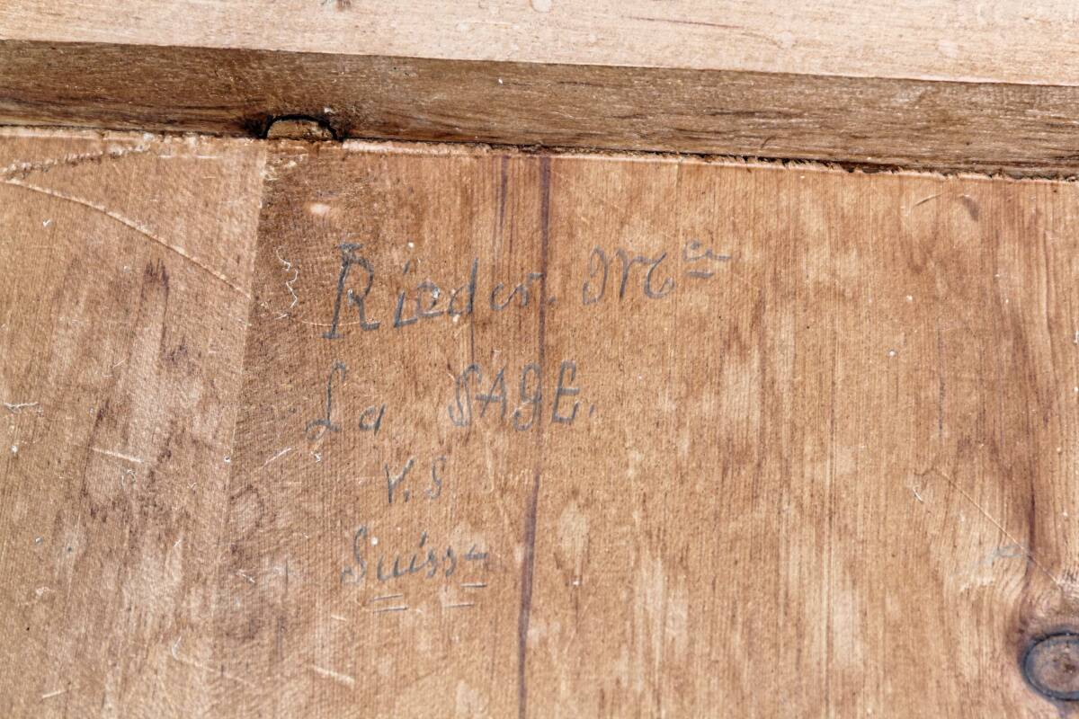 Old Swiss escabelle chair in carved wood