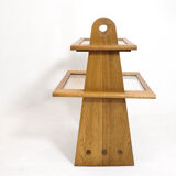 Served in oak and glass from the 50s and 60s.