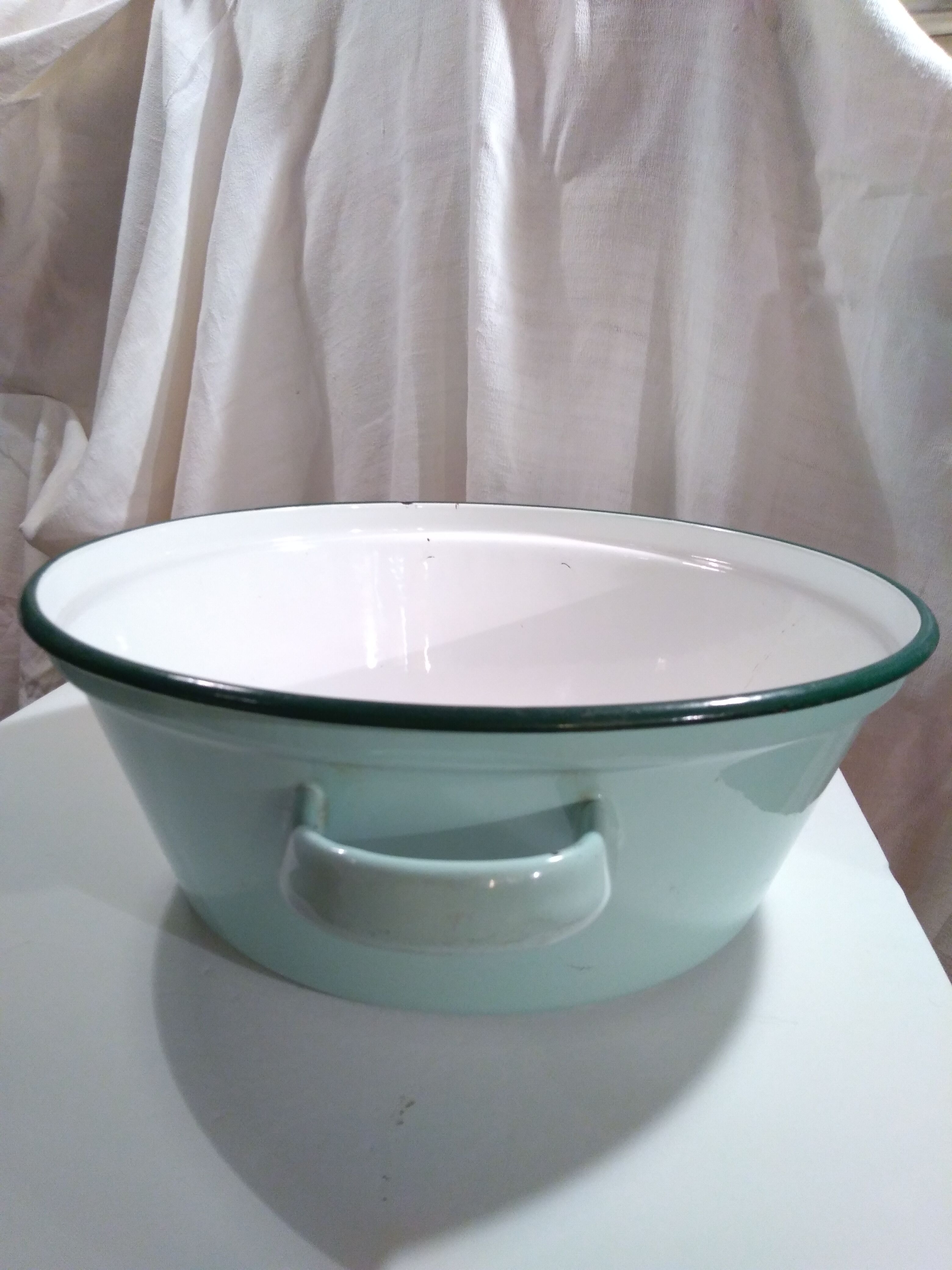 Ancient enamelled sheet metal basin