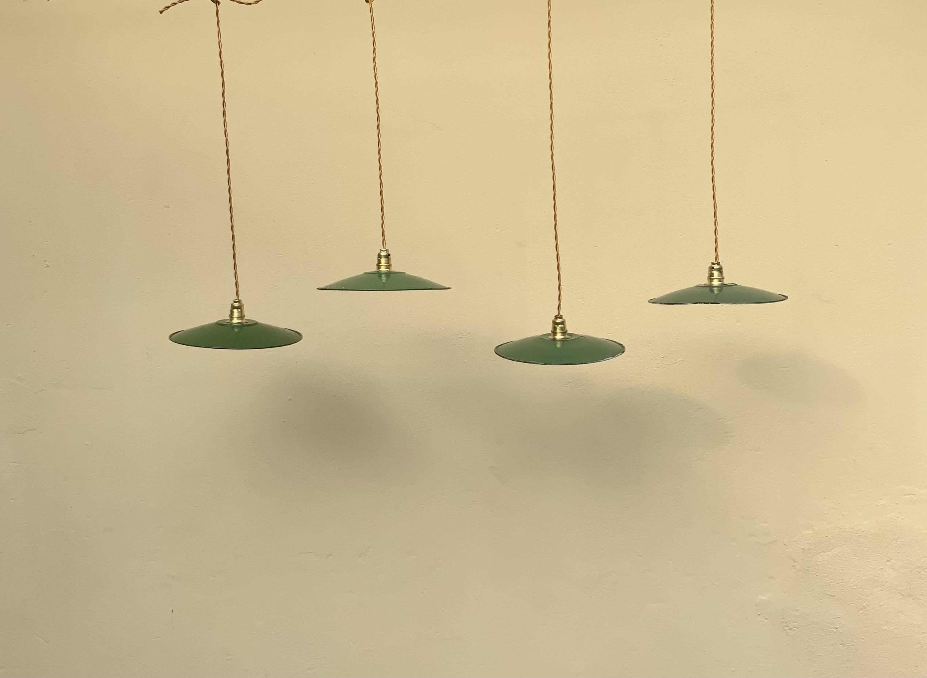 Vintage industrial enameled sheet metal pendant lights with golden wires, old green and white lampshade