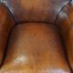 Sheepskin armchair/lounge chair finished with decorative nailheads