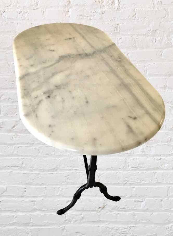 Oval marble and cast iron bistro table