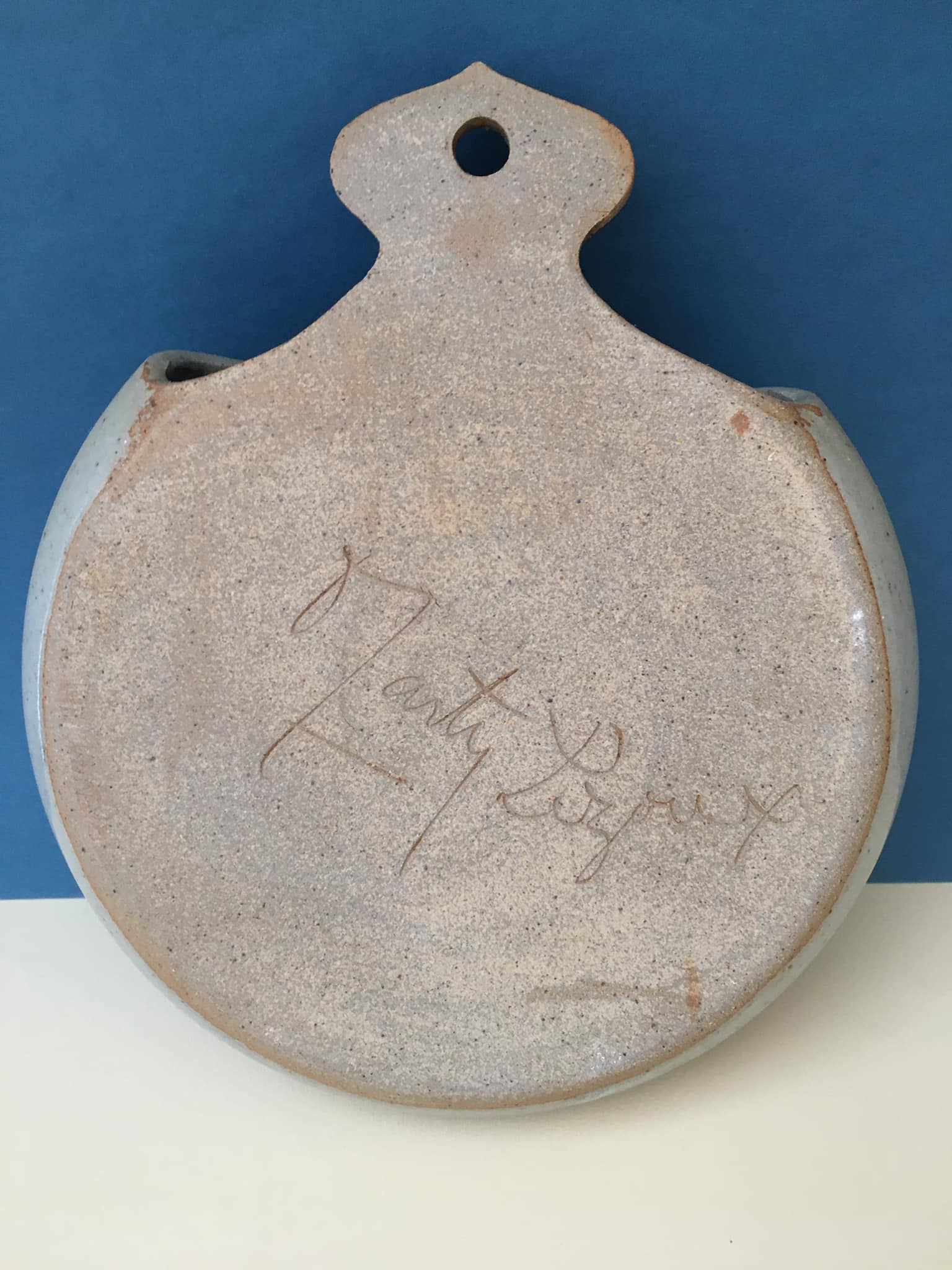 Ceramic wall plant holder with floral motifs, unknown signature