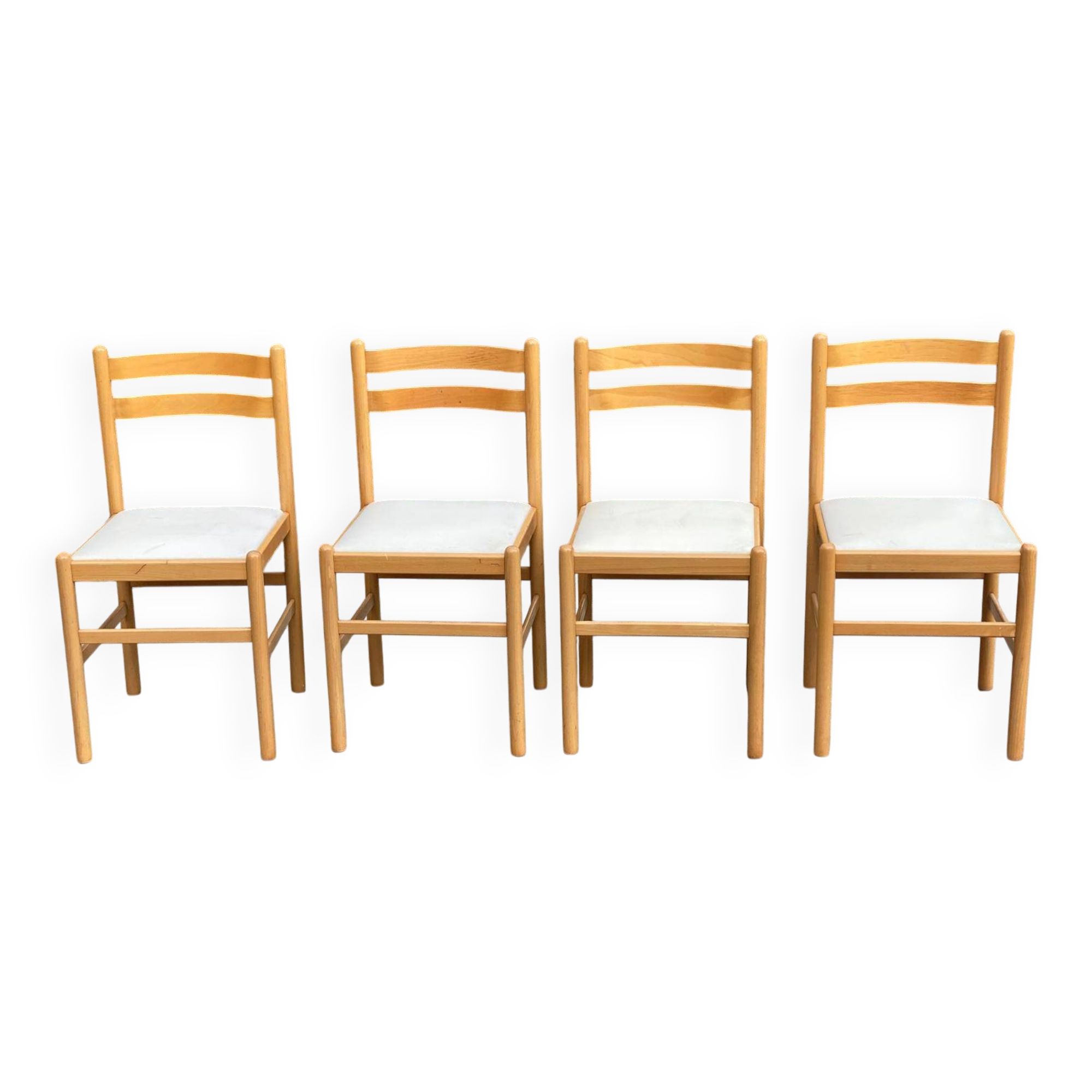 4 solid wood and white leather chairs