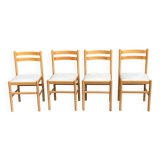 4 solid wood and white leather chairs