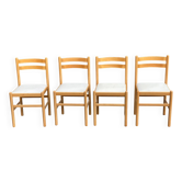 4 solid wood and white leather chairs