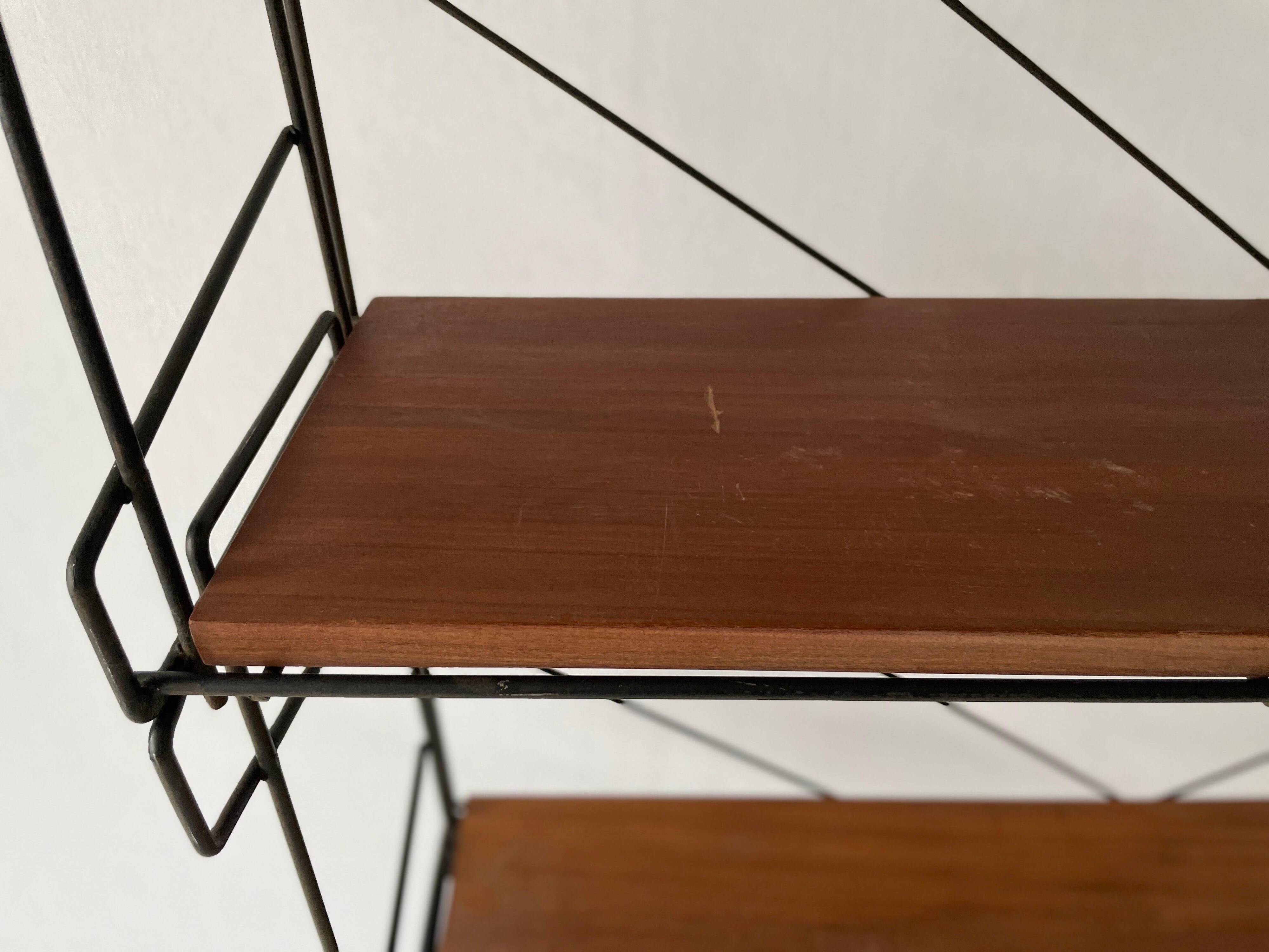 Free-standing shelf with a metal structure and 3 shelves, 1960s, Italy.
