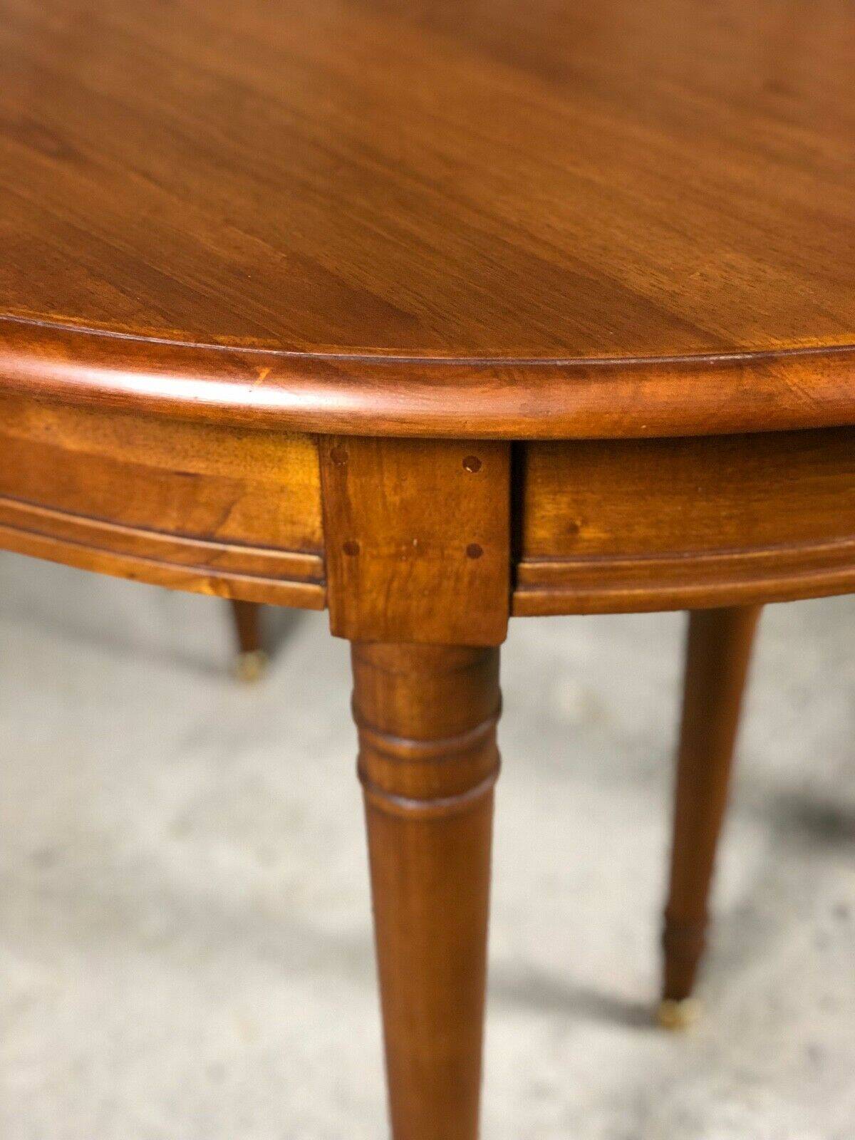 Oval walnut table with 6 legs from 1m12 to 2.94 (4 extensions of 45.5 cm)