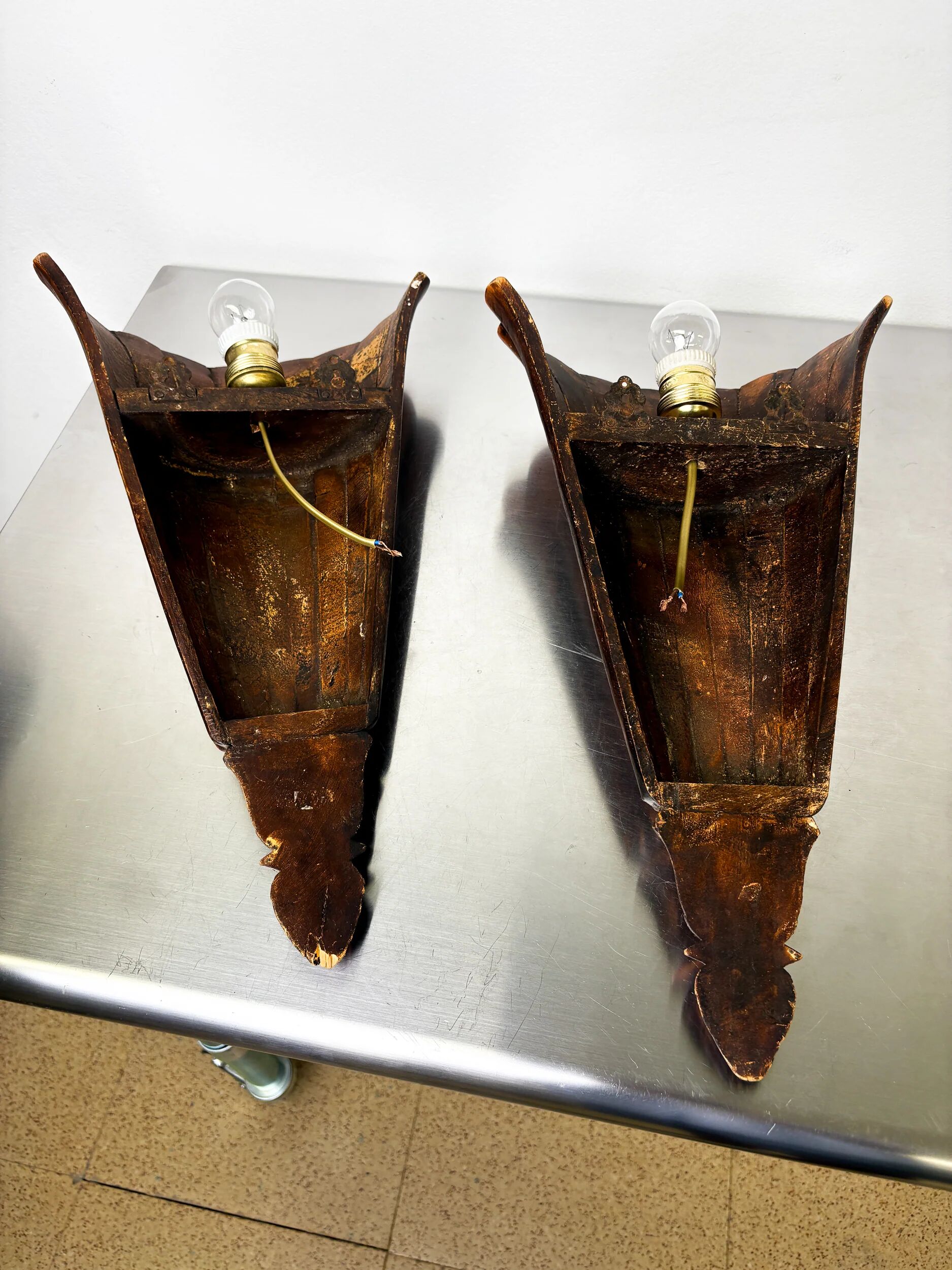 Pair of Art Deco carved wood wall sconces, France, 1930s