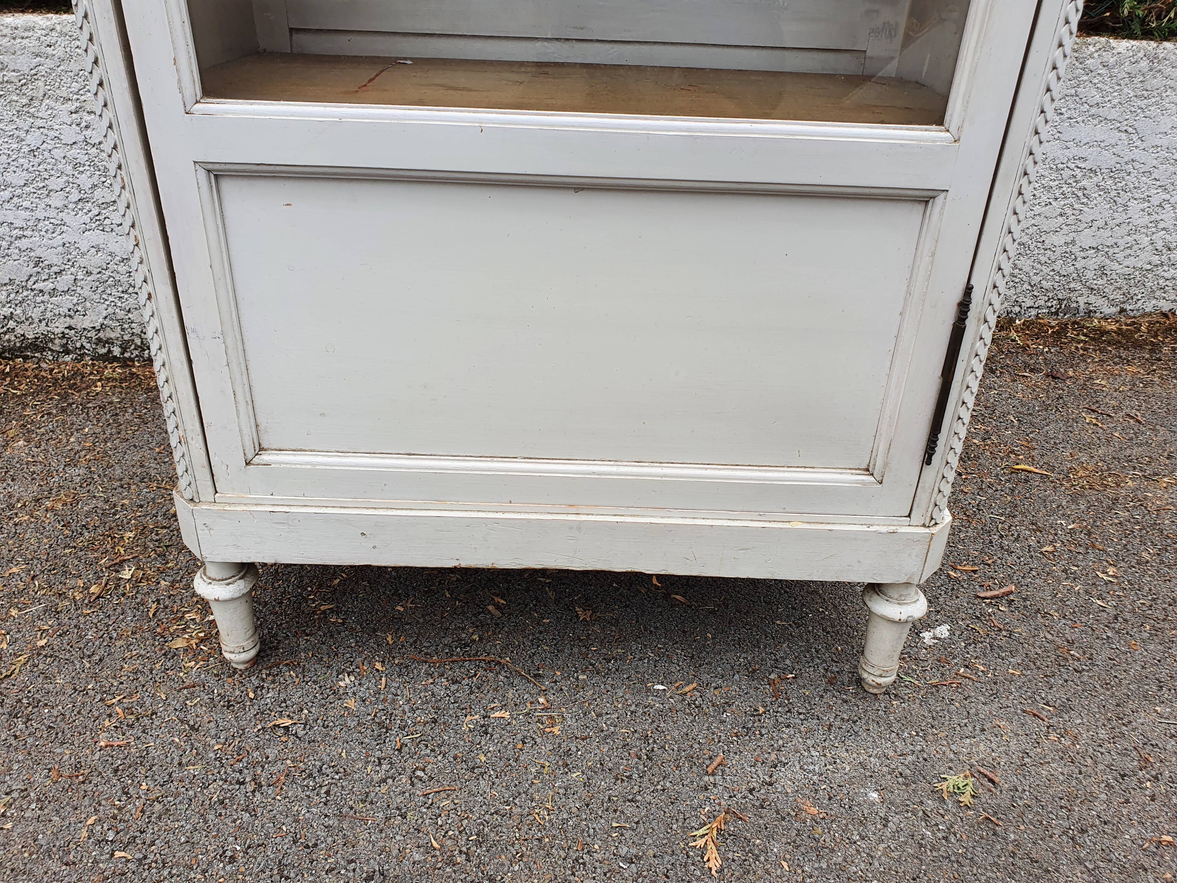 Old grey patinated showcase