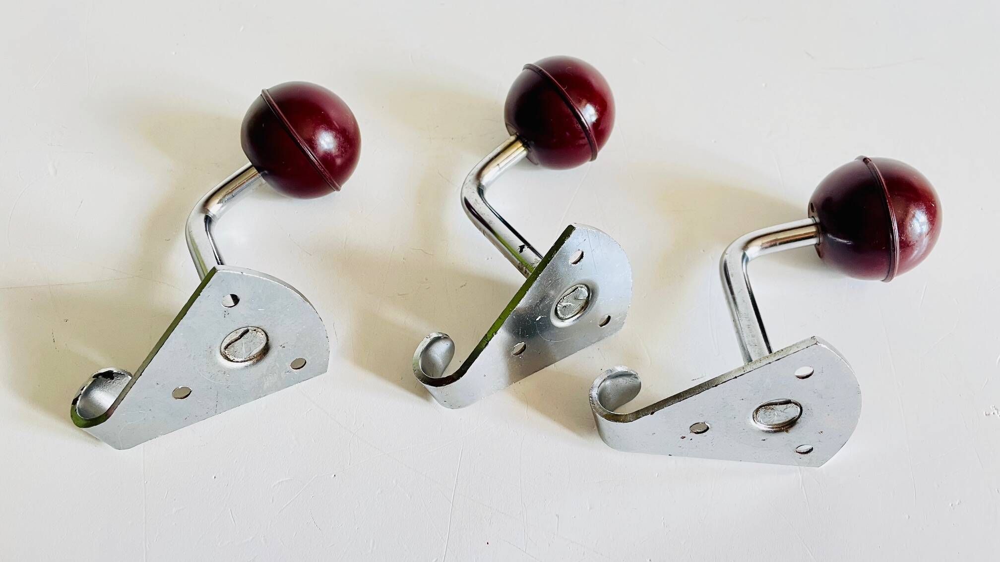 Chrome and bakelite coat hooks from the 70s