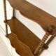 Vintage turned wood wall shelf with 3 levels.