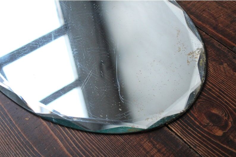 Old oval beveled art deco mirror