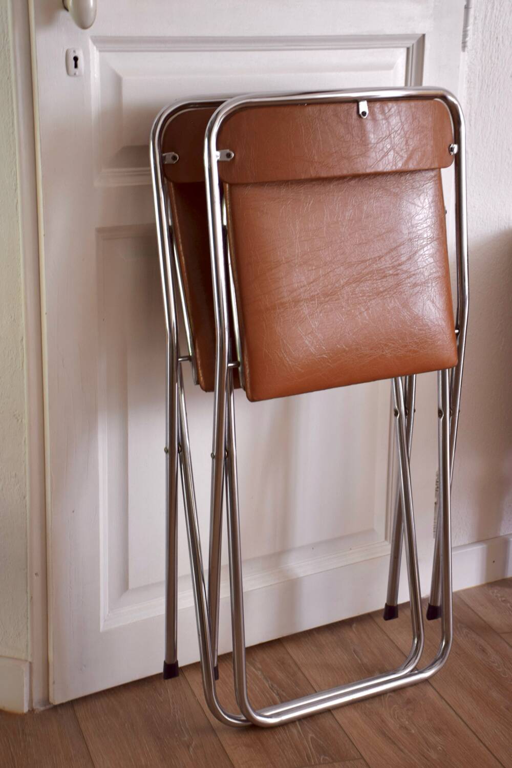 Pair of “Soudexvinyl” folding chairs in skai and chrome tube