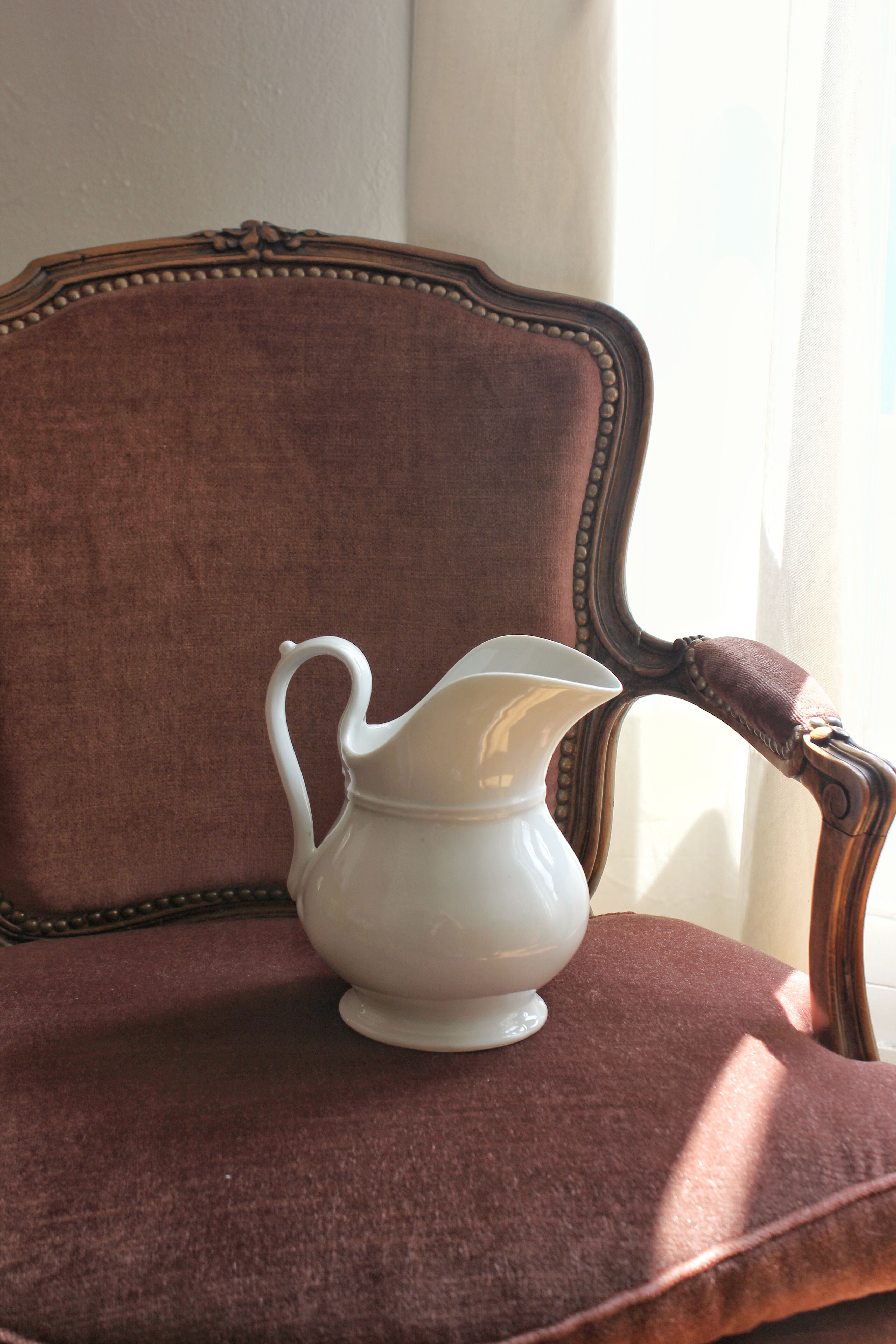 Antique white porcelain jug from the 19th century