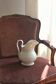 Antique white porcelain jug from the 19th century