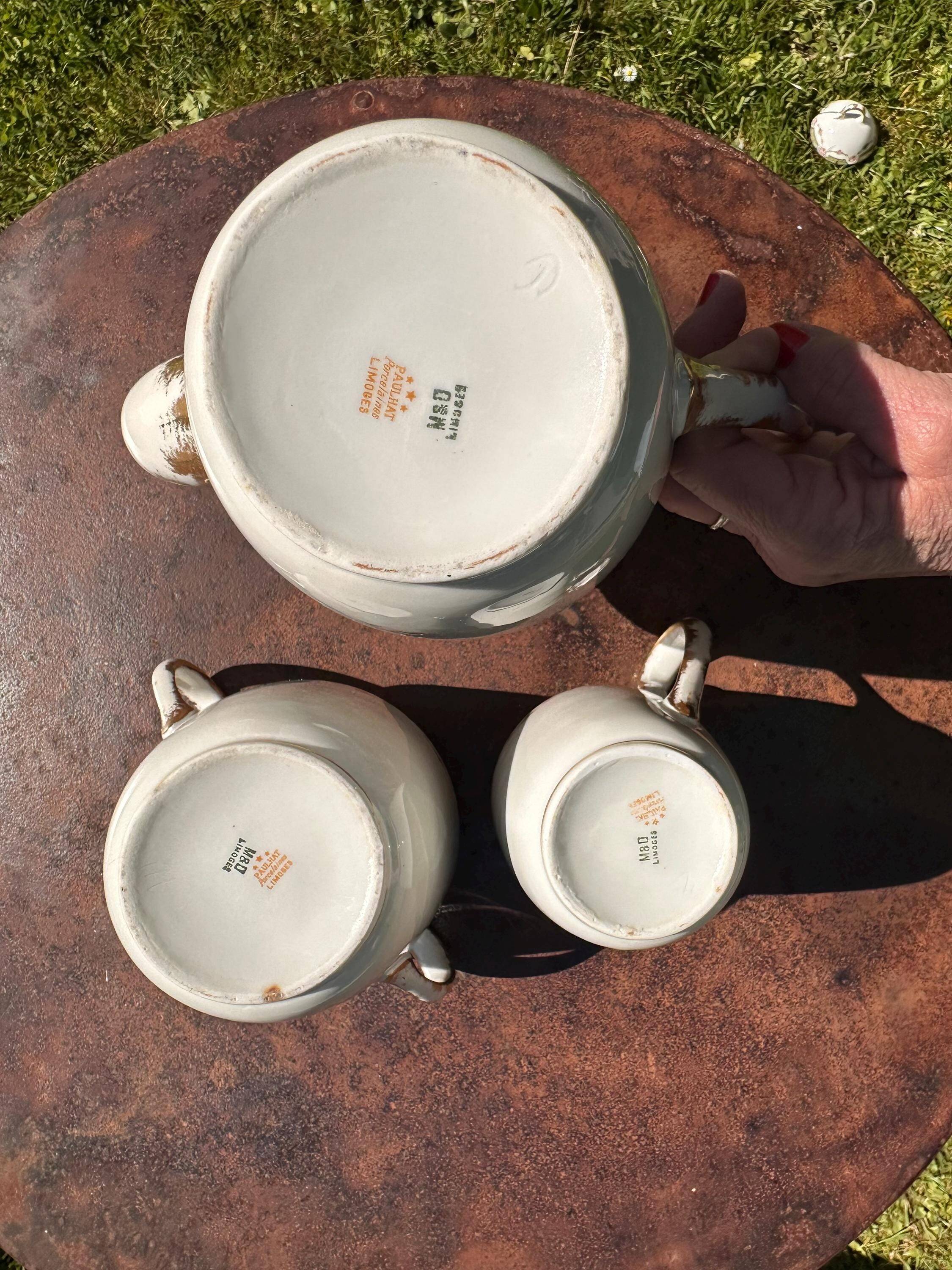 Set of jug, sugar bowl, and milk jug in Limoges porcelain by Paul Past.