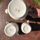 Set of jug, sugar bowl, and milk jug in Limoges porcelain by Paul Past.