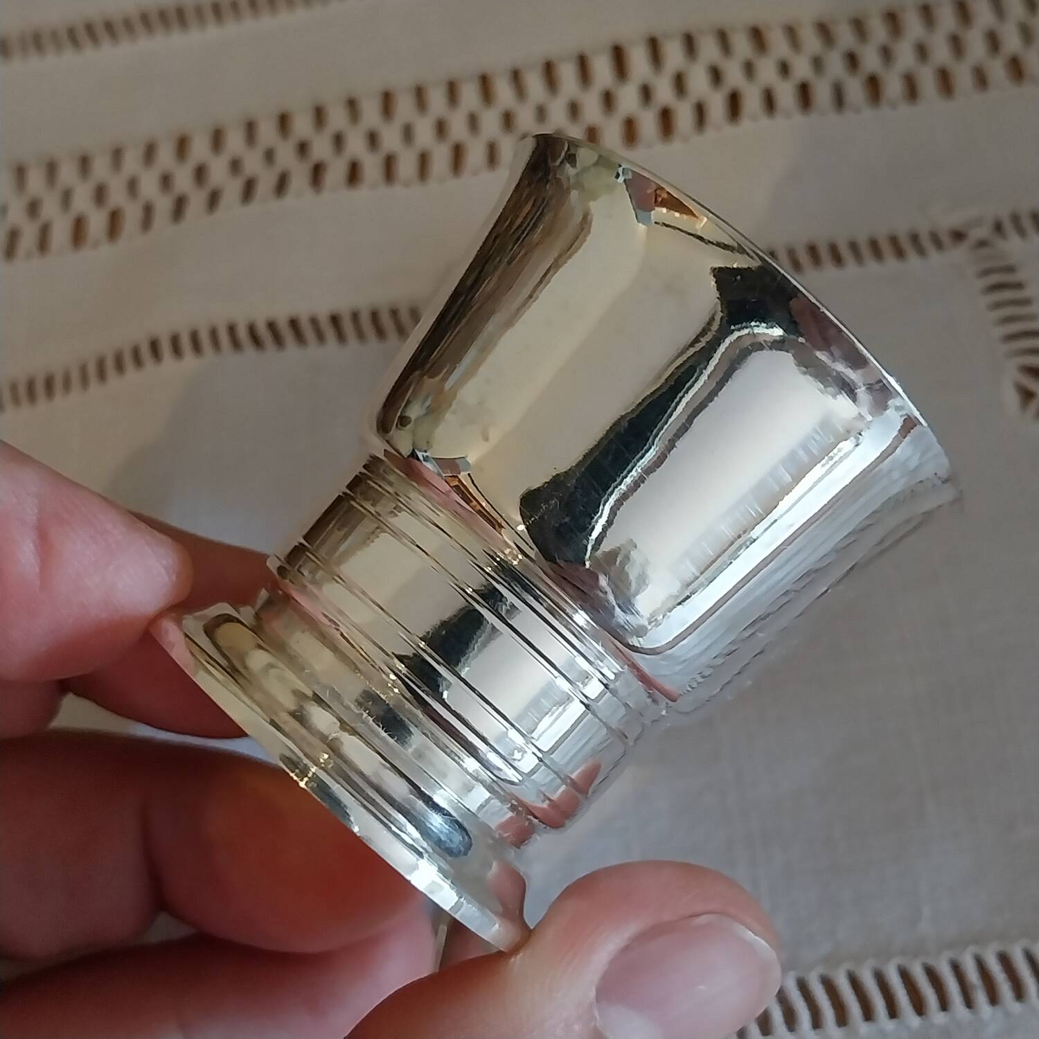 Egg cup and spoon in silver metal