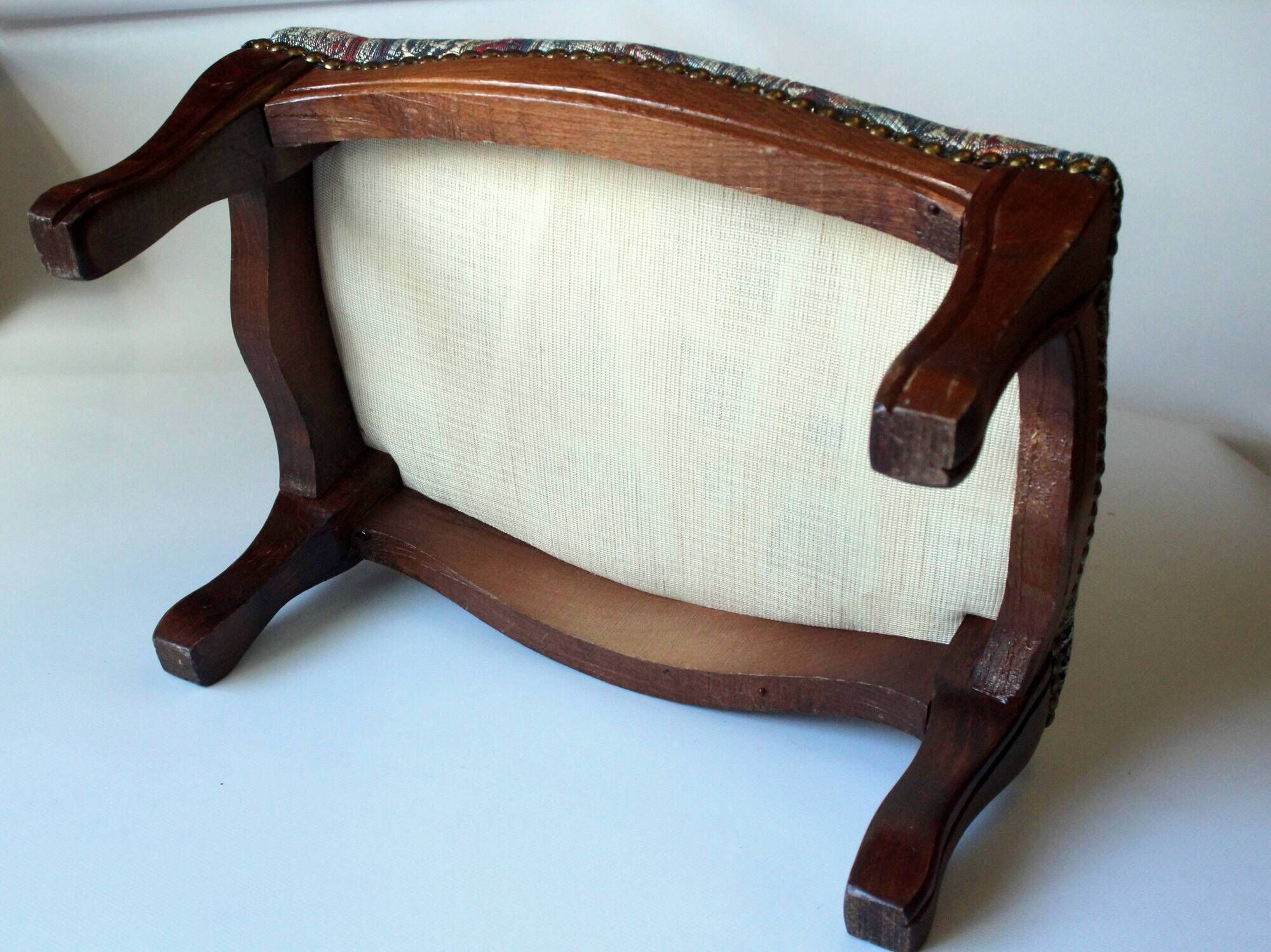 Small foot stool made of wood with upholstery, vintage from the 70s