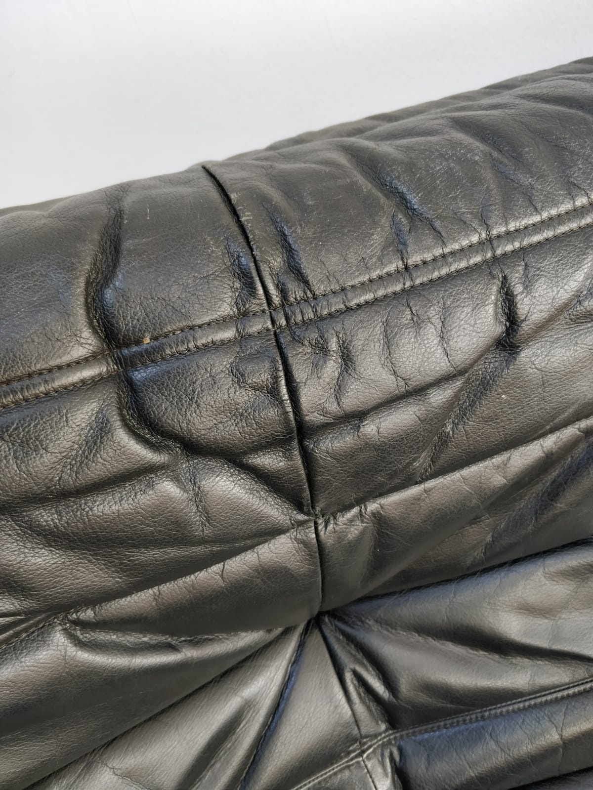 Togo in black leather by Ligne Roset