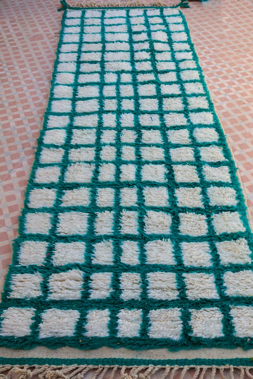 Moroccan hallway rug with inverted pine green and white checkerboard