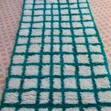 Moroccan hallway rug with inverted pine green and white checkerboard