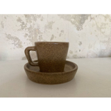Set of stoneware coffee cups with saucers.