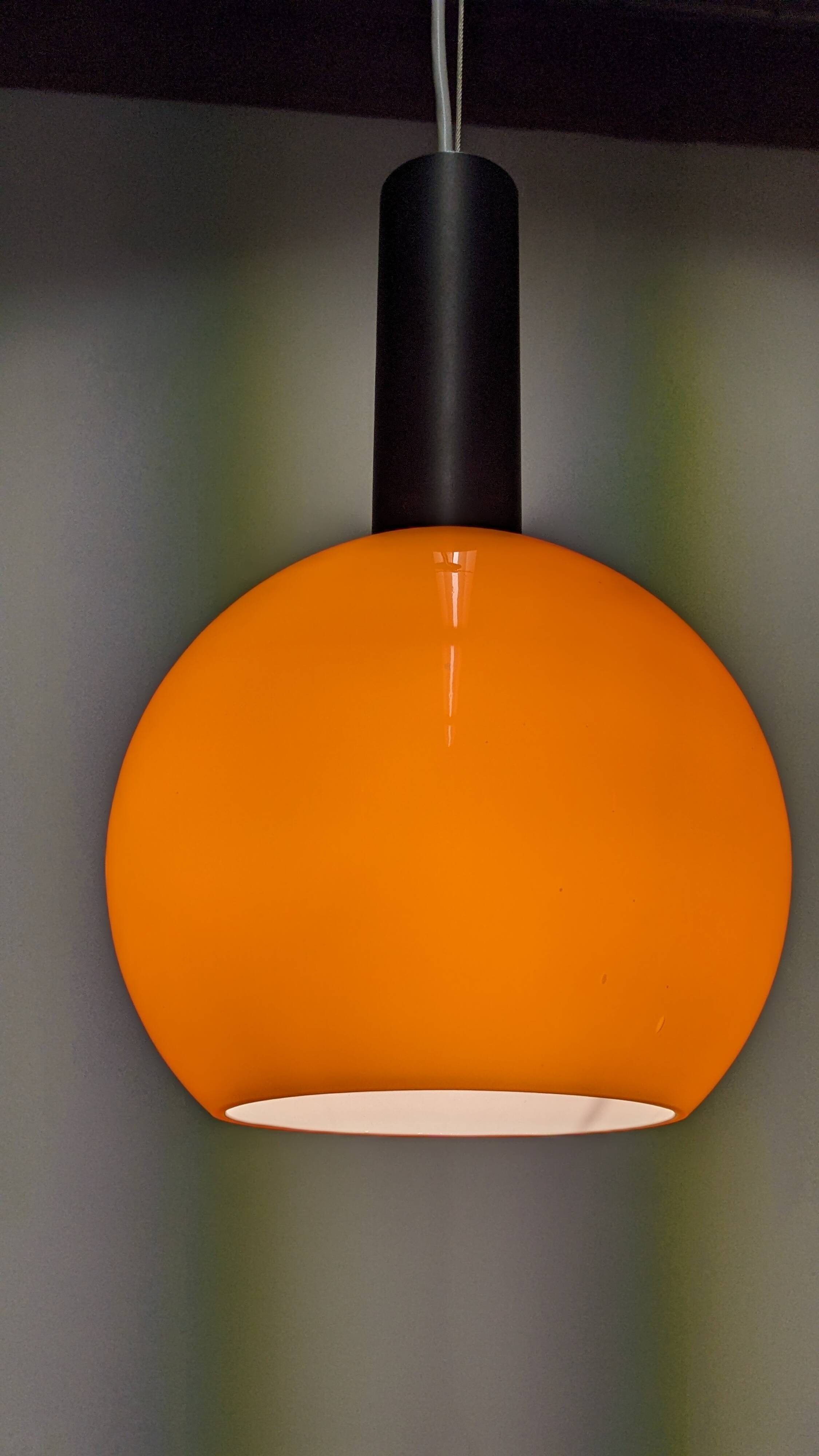 Pair of orange opaline ball pendants by Parscot, France circa 1970.