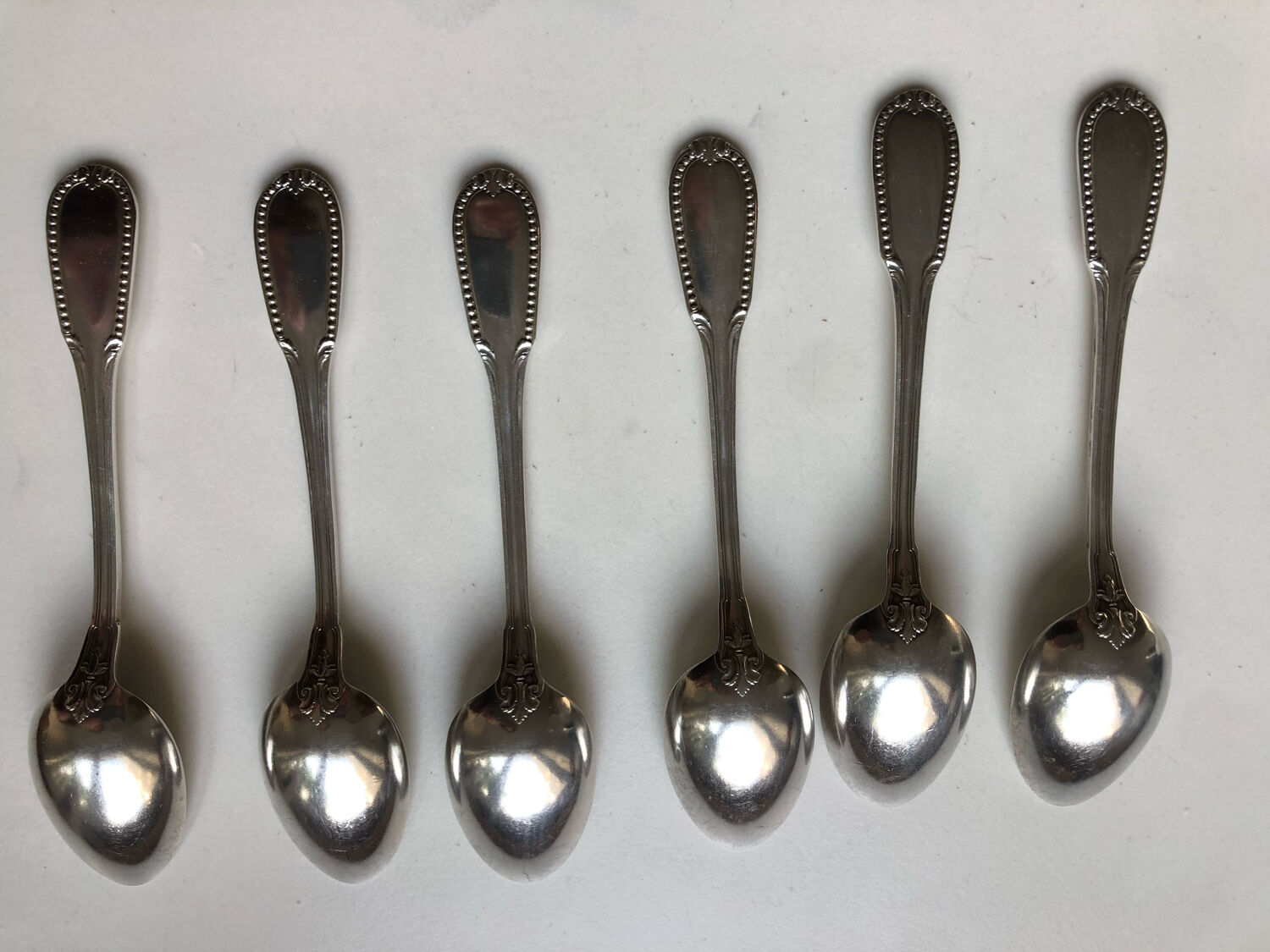 6 small silver metal spoons