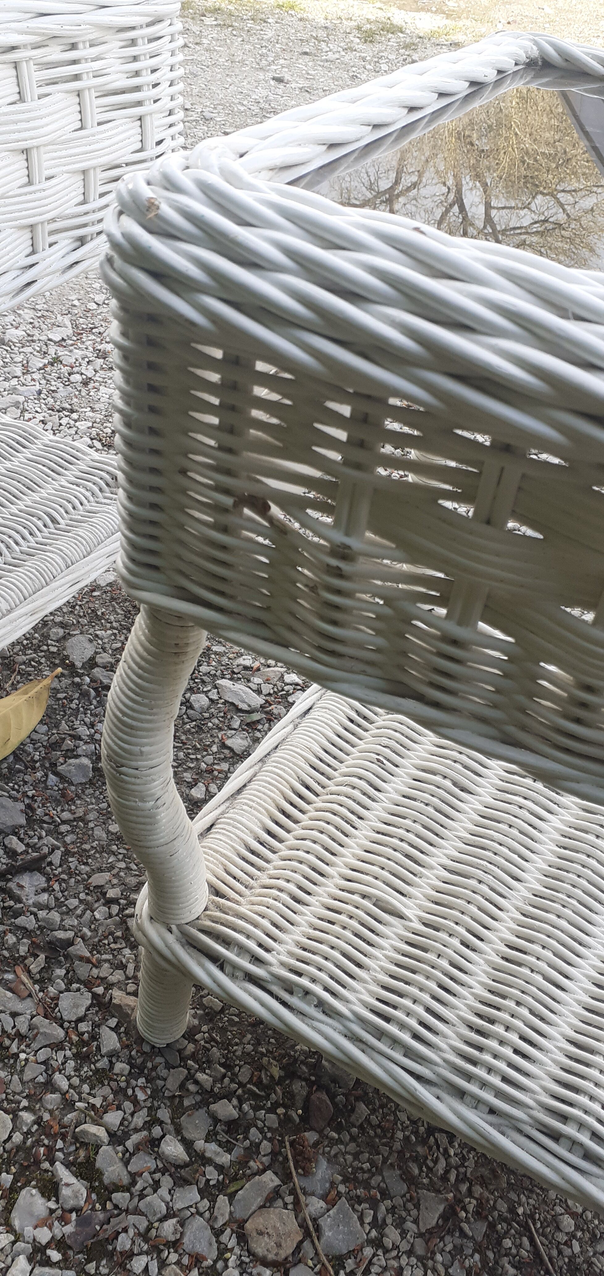Pairs of white rattan side tables and smoked glass
