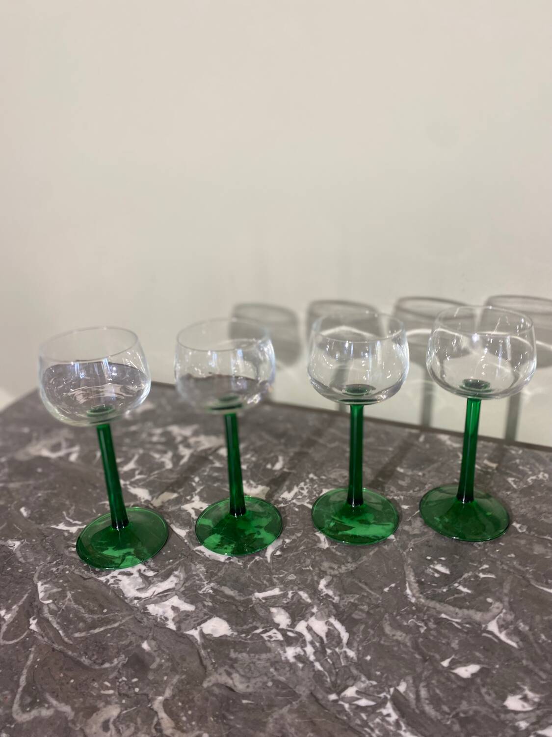 4 green stemmed glasses