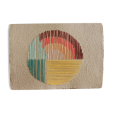 Rainbow embroidery on rag paper