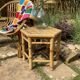 Set of three vintage rattan side tables.