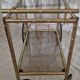 Rolling dessert trolley in gilded brass & glass from the 1970s in the style of Maison Jansen.