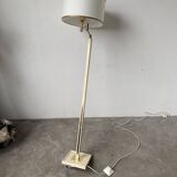 Floor lamp with articulated arm in brass-plated metal