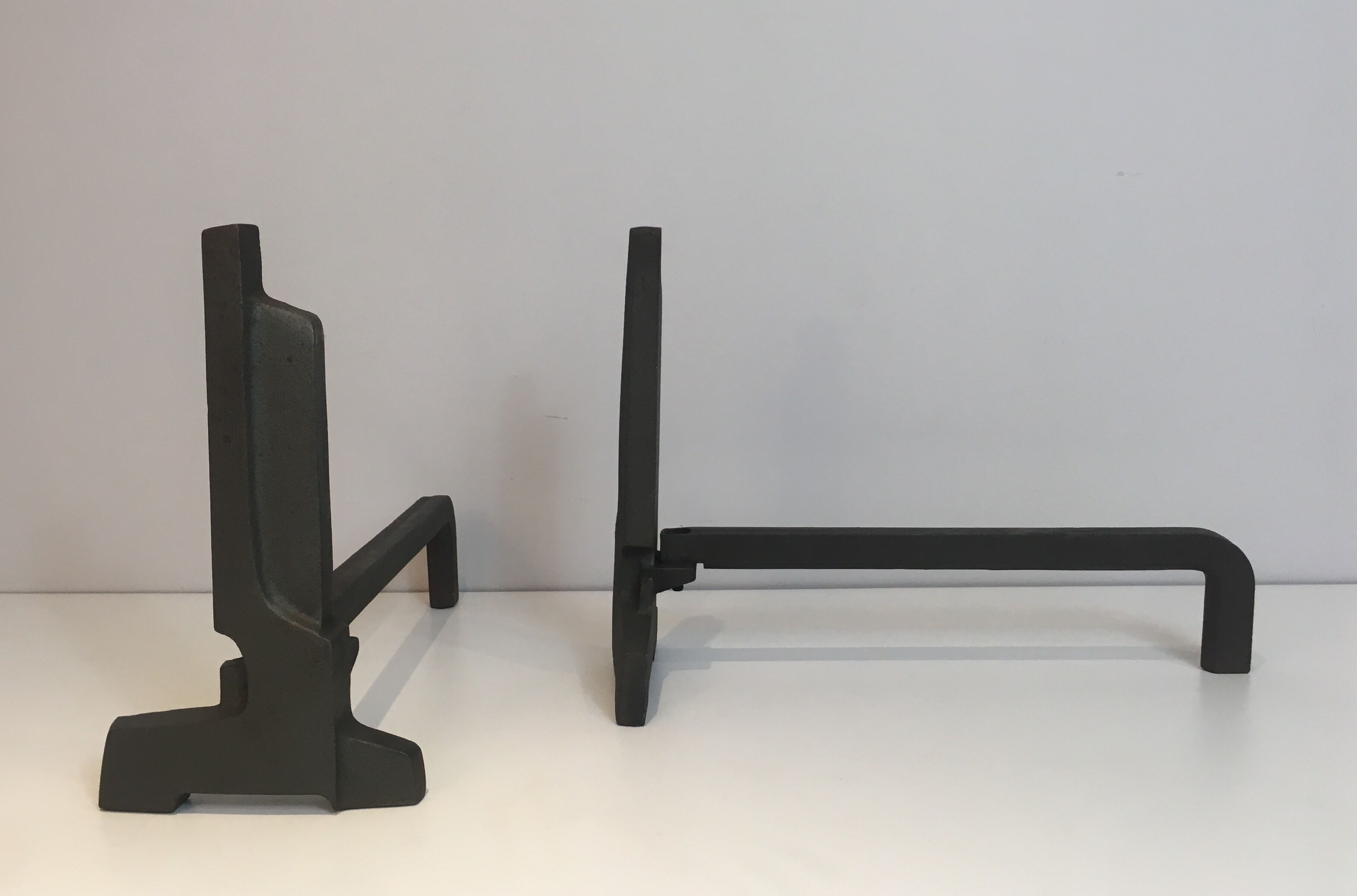 Pair of modernist chenets in cast iron and iron