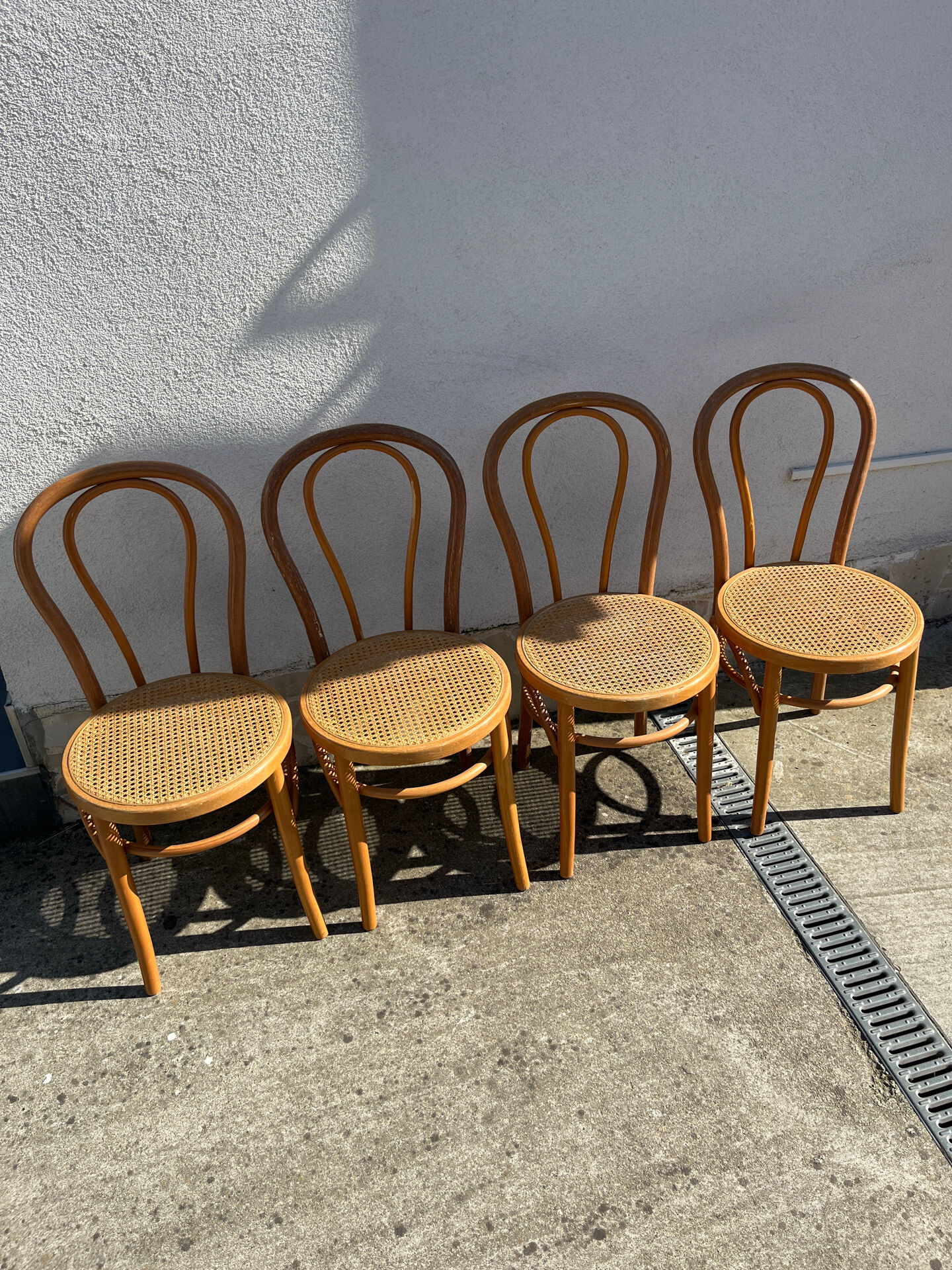 Set of 4 bentwood bistro chairs with caning.