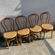 Set of 4 bentwood bistro chairs with caning.