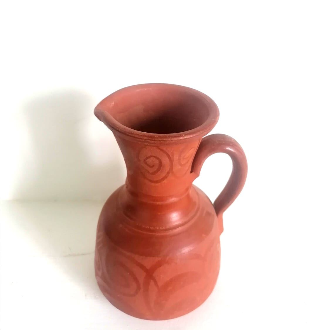 Pitcher in oriental terracotta