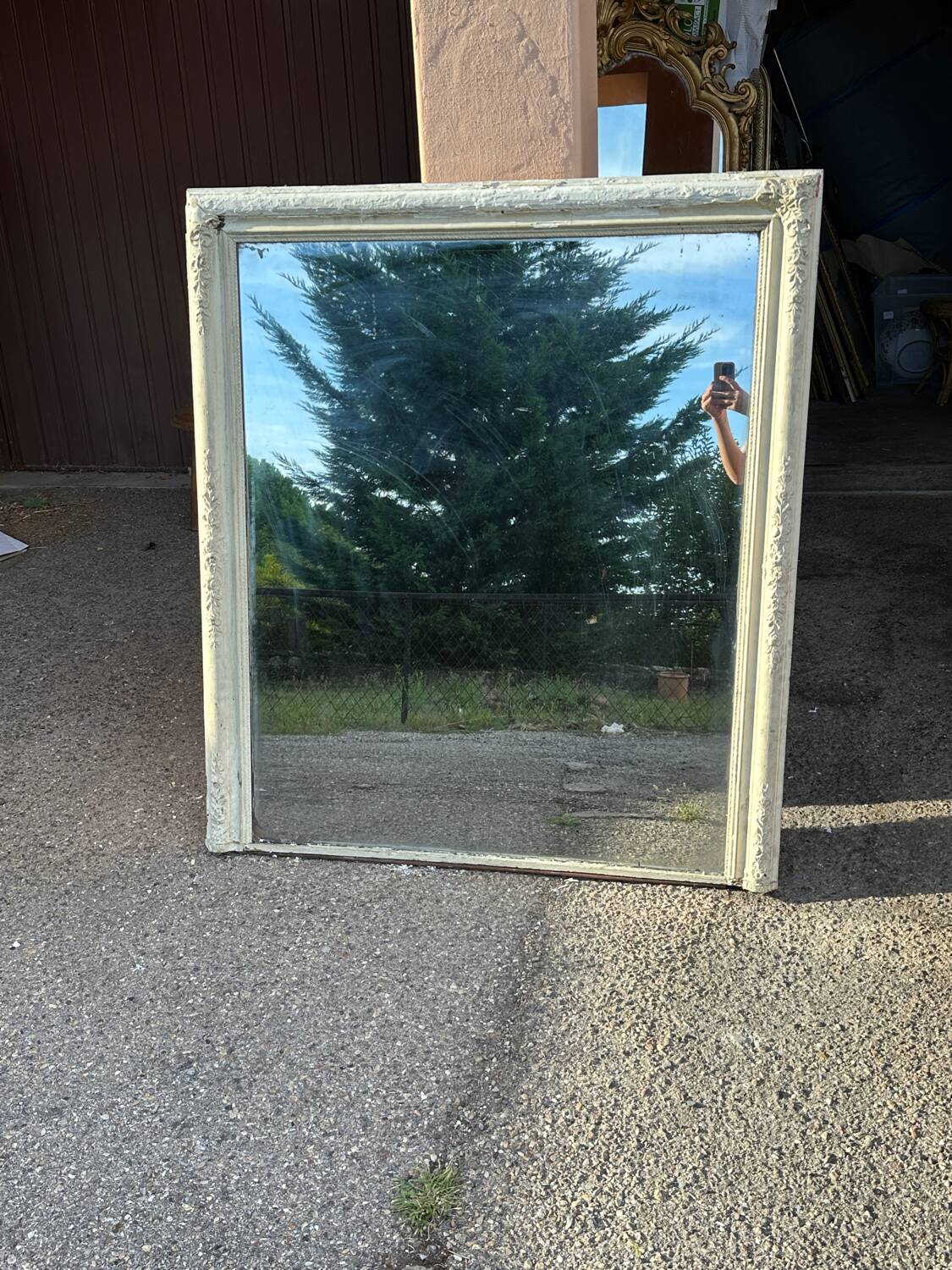 Wooden mirror with off-white stucco